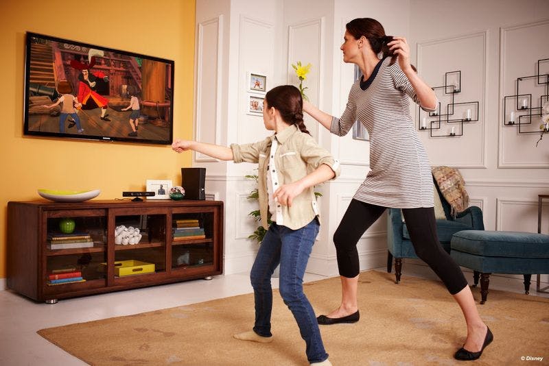 Woman and girl playing xbox kinect